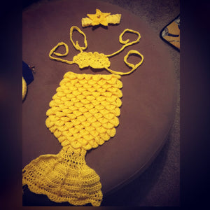 a yellow crochet mermaid tail