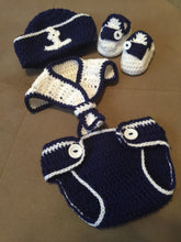 A crochet navy and white sailor outfit