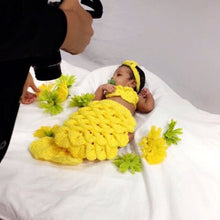 Baby with a yellow crochet mermaid tail