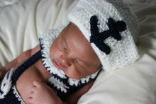 Baby with a crochet navy and white sailor outfit