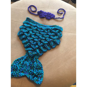 a multi color crochet mermaid tail