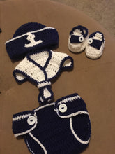 A crochet navy and white sailor outfit