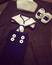 A crochet navy and white sailor outfit